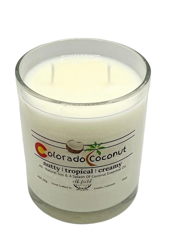a white candle in a glass jar