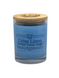 A glass jar candle with a light blue label reading 'Crisp Linen' and a natural wood lid, photographed on a plain white background.