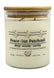 a white candle with a lid 12oz