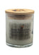 A glass jar candle with off-white wax, a bamboo lid featuring a dark rustic logo, and a paper label that reads 'Rustic Wood & Rum'. Fall and Holiday candle.